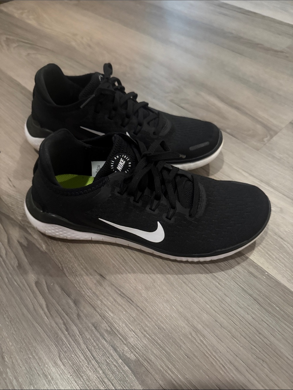 Nike Black Athletic Shoes with White Swoosh